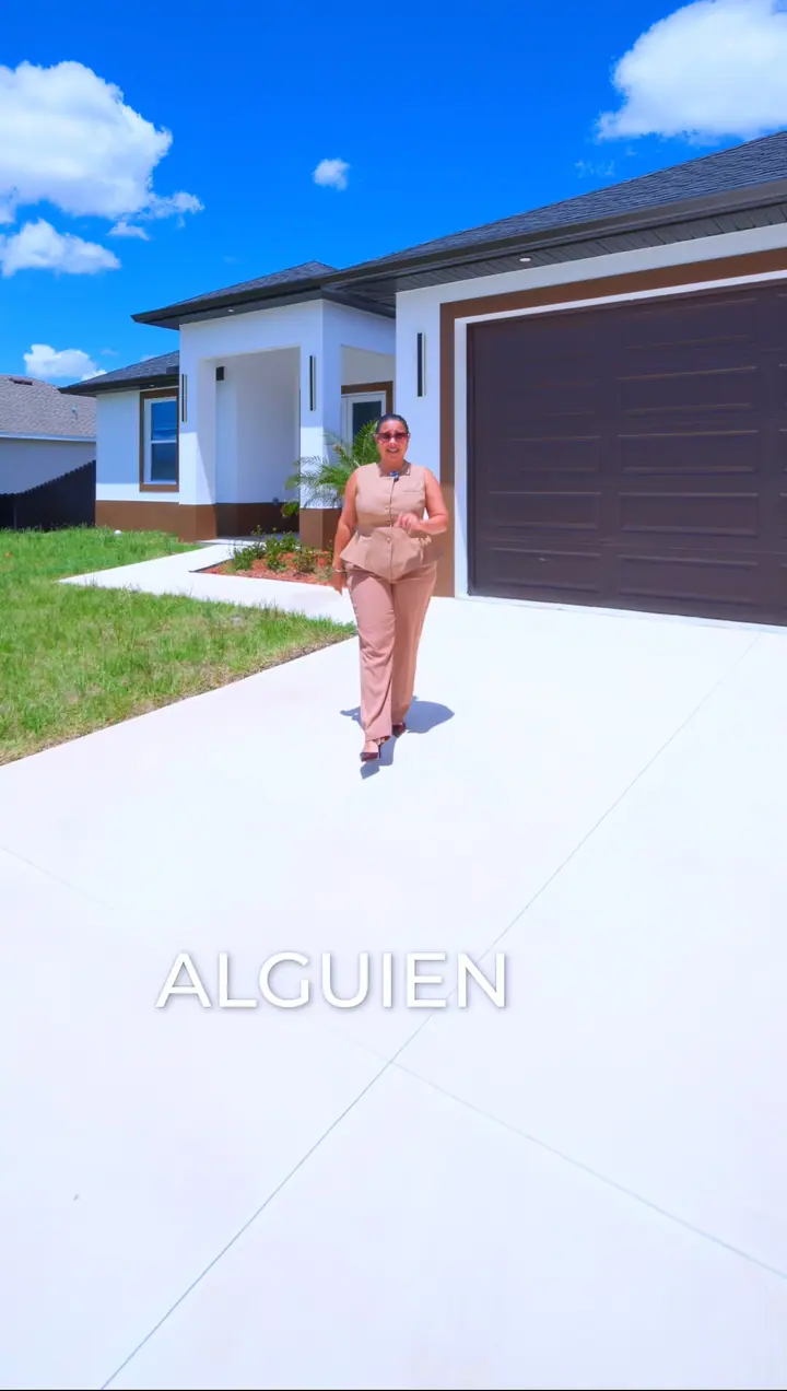 Agent walking toward a listing in an Athena reel